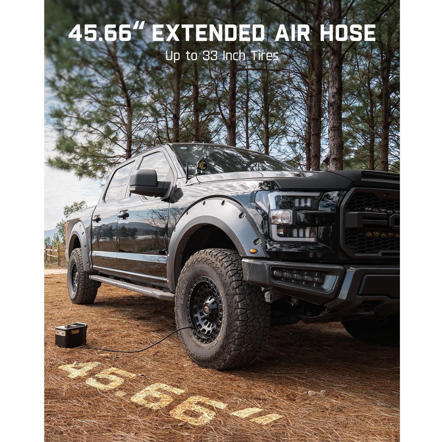 Fanttik X9 Ultra tire inflator with 45.66" extended air hose, connected to a black Ford Raptor truck with 33-inch tires.