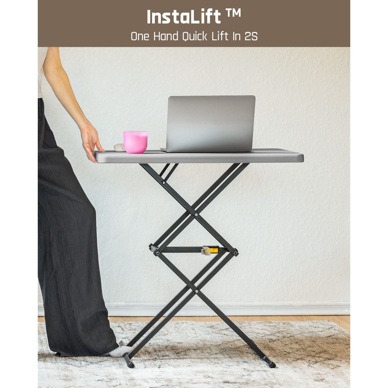 FanttikOutdoor Zeta X1 Pro portable standing desk with laptop, pink cup, and InstaLift "One Hand Quick Lift In 2S" branding.