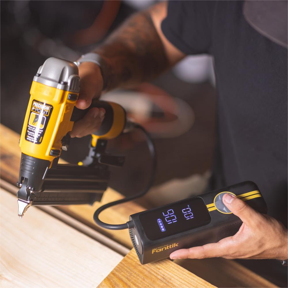 Fanttik X8 APEX tire inflator with digital display alongside a pneumatic nail gun.